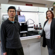 Two faculty members stand in the Medicinal Chemistry Center