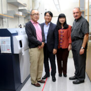 WiscNANO faculty stand together in the lab